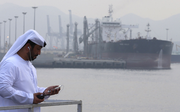 An Emirati man stands at the oil terminal of Fujairah during the inauguration ceremony of a dock for supertankers on Wednesday (AFP photo)